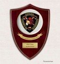 Custom crest plaque on heart-shaped mahogany wood with round porcelain